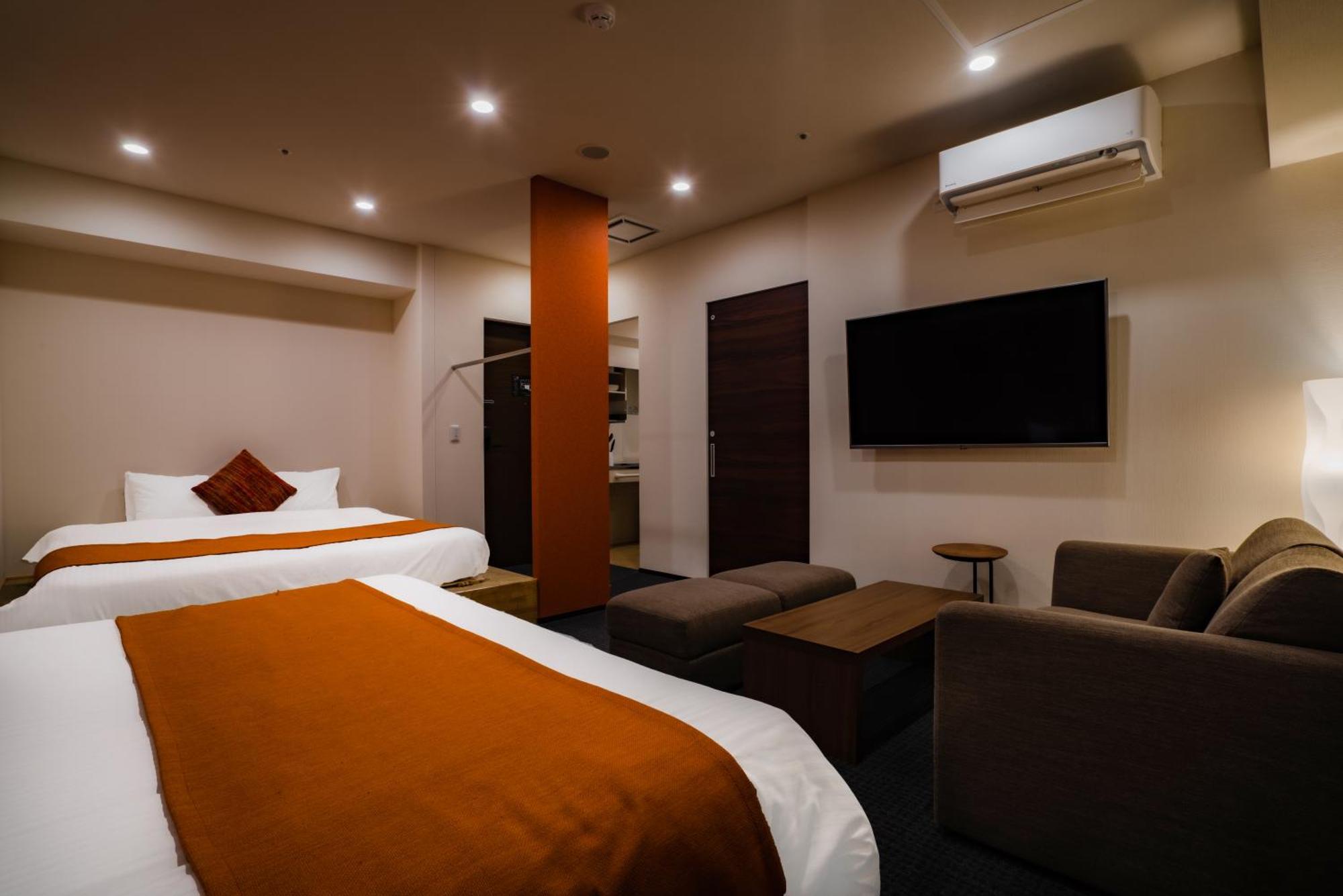 Randor Hotel Sapporo Suites Kamer foto A room at the hotel