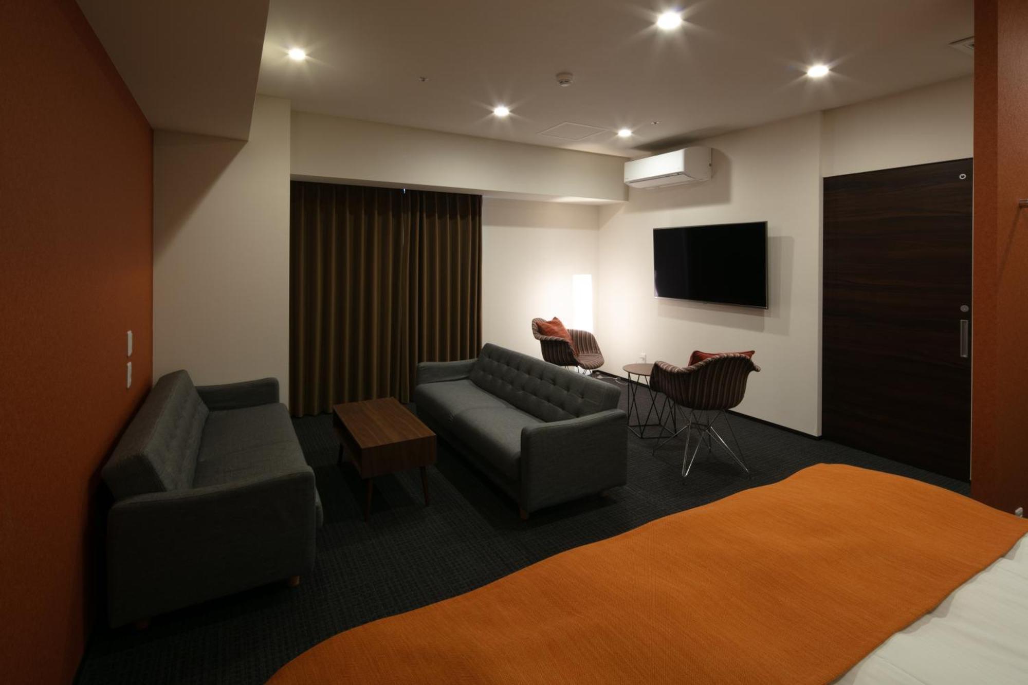 Randor Hotel Sapporo Suites Kamer foto A room at the hotel
