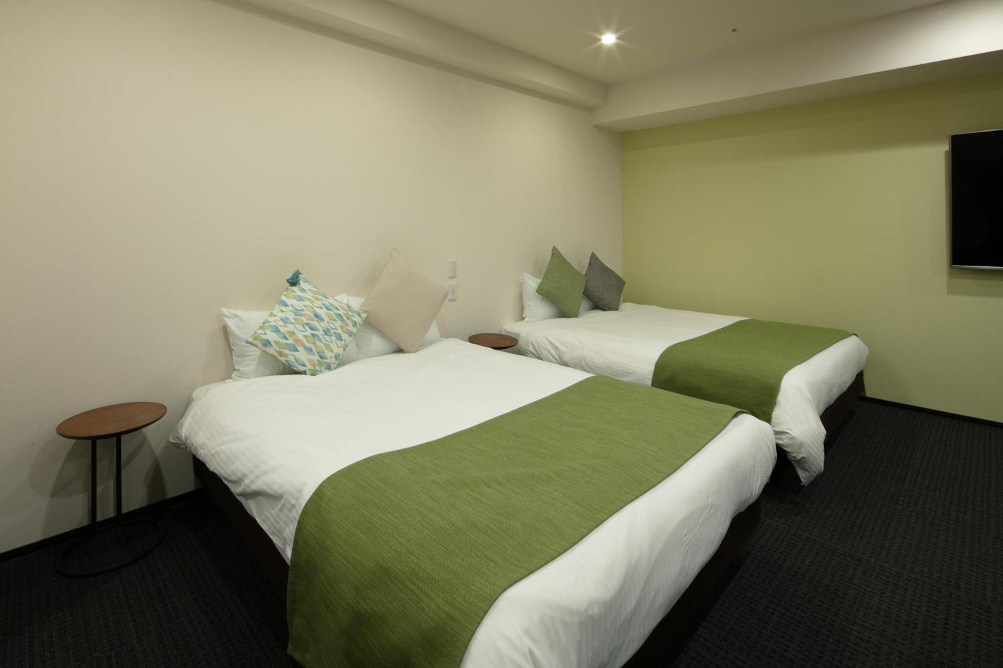 Randor Hotel Sapporo Suites Kamer foto A room at the hotel